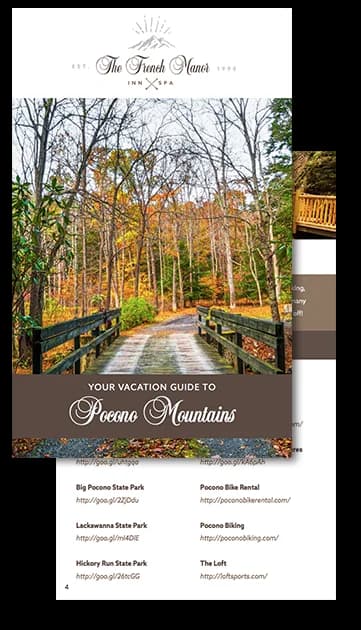A vacation guide cover featuring a scenic path through autumn trees in the Pocono Mountains.